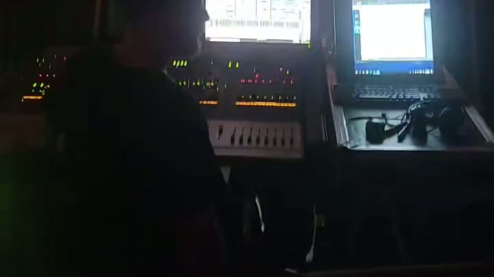 At the control desk running the live visuals